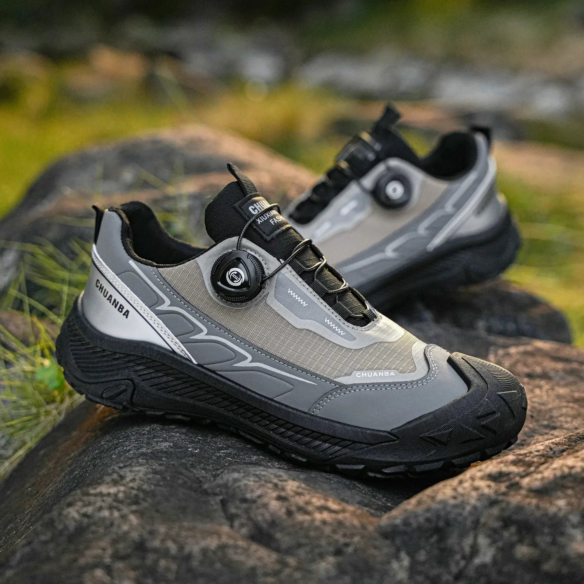 Two gray CHUANBA low-top sneakers with black soles; lace-up walking shoes for daily wear