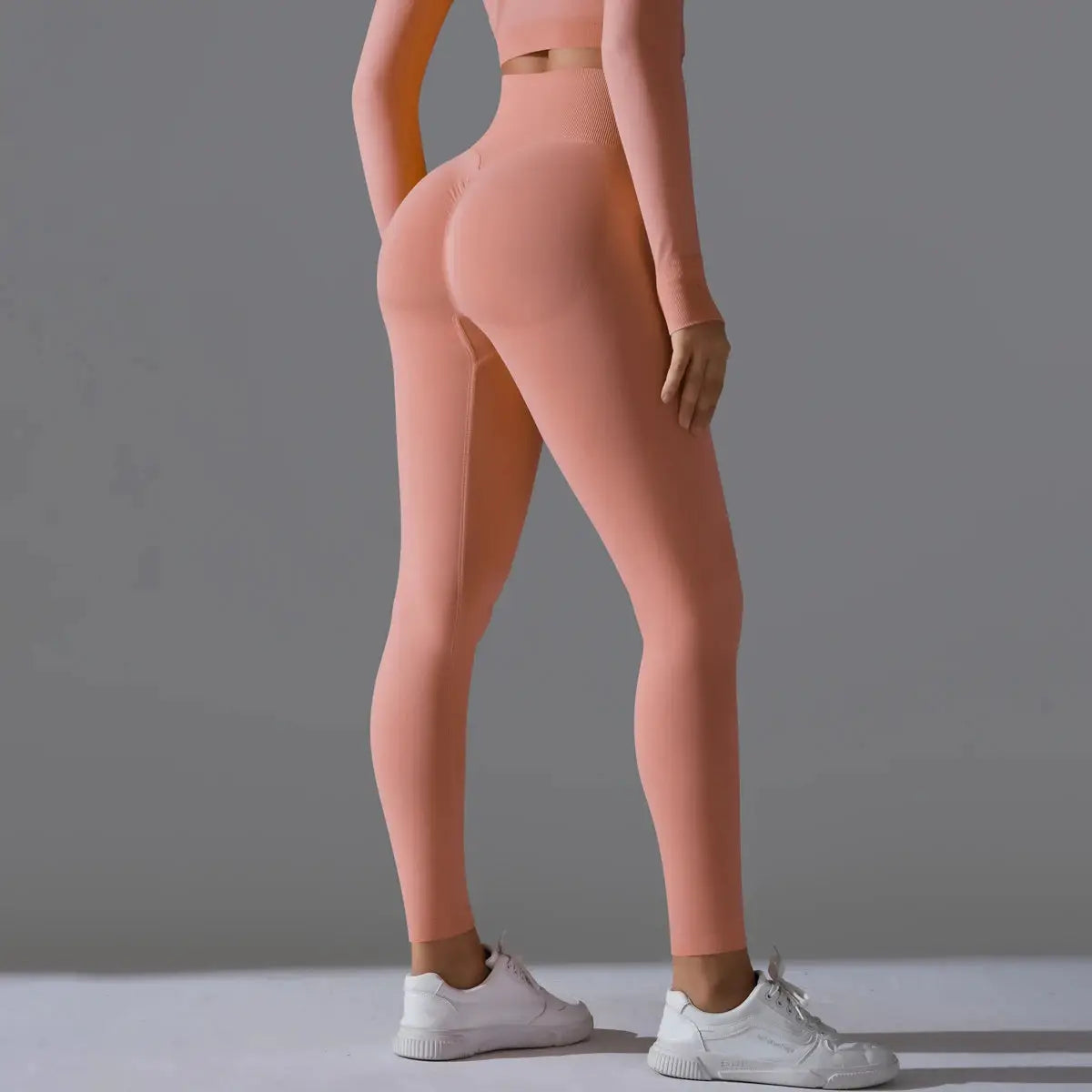 Women's peach seamless yoga leggings with high waist tummy control and scrunch butt lift for gym workouts