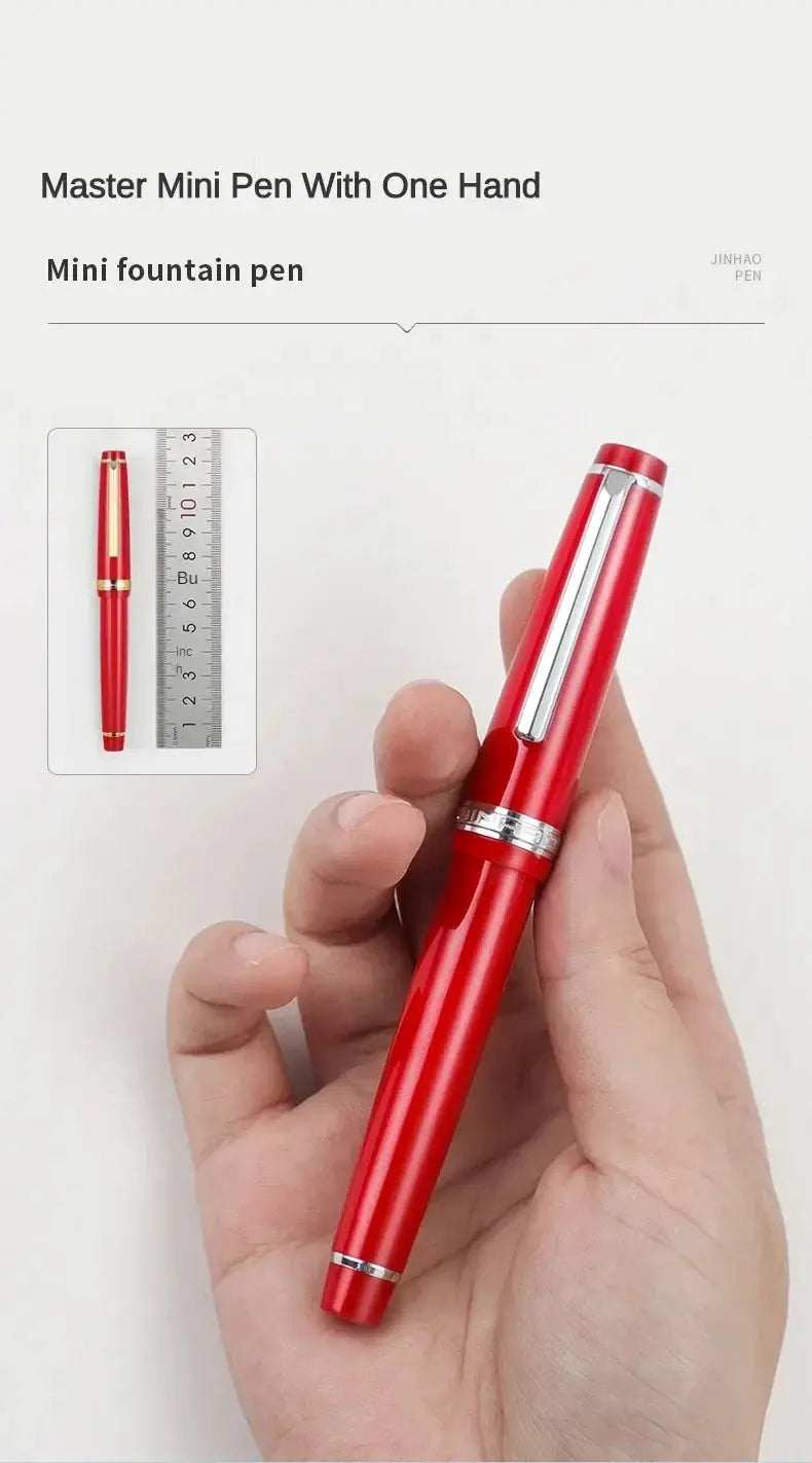 Jinhao 82 red fountain pen with silver clip and rings; held in hand with ruler inset for scale.