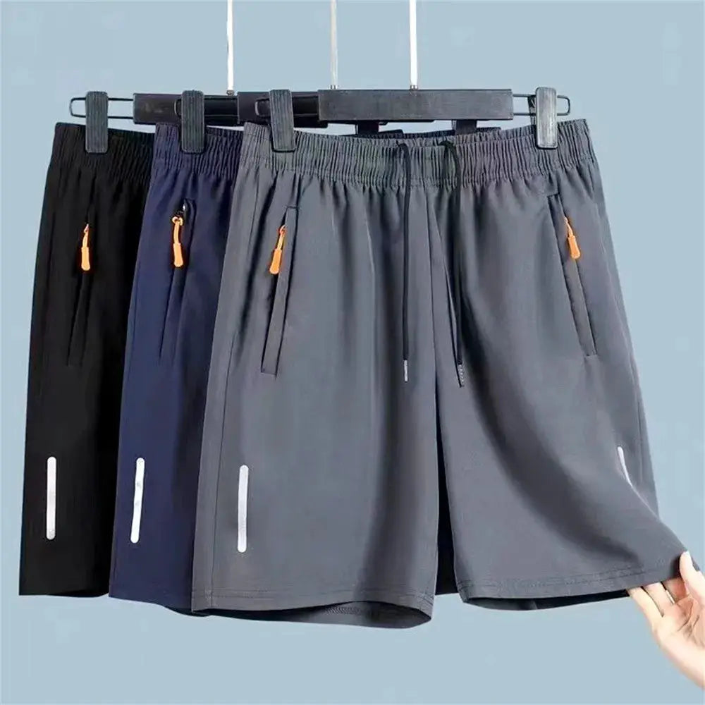 Men's ultra-thin ice-silk athletic shorts set of 3 in black, navy, and gray with zip pockets and elastic waist.