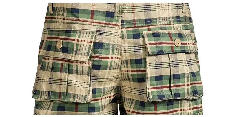 Men's plaid cargo shorts in green and beige cotton with large side pockets and buttoned flap pockets