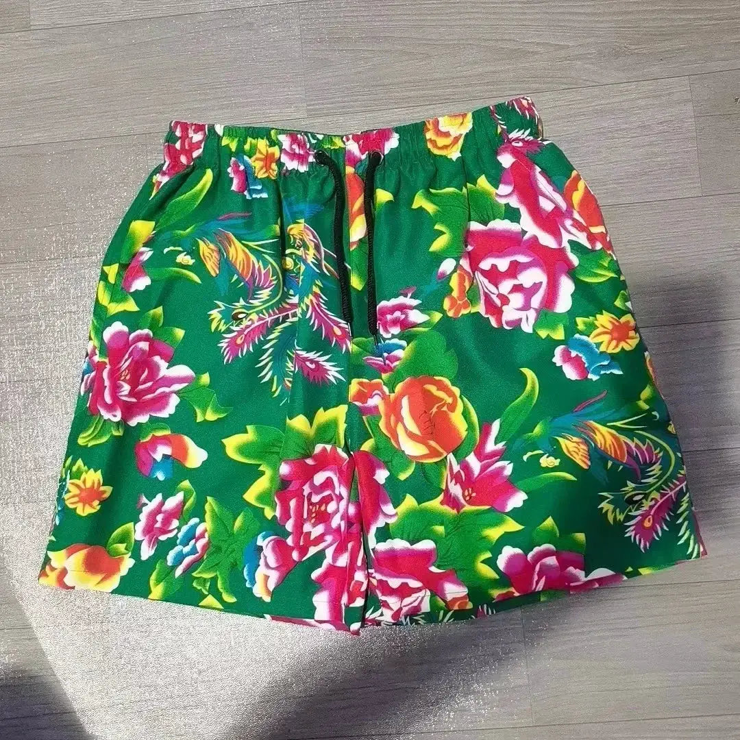Men's board shorts in green floral print with a black drawstring and tropical bright flowers, sizes M-5XL