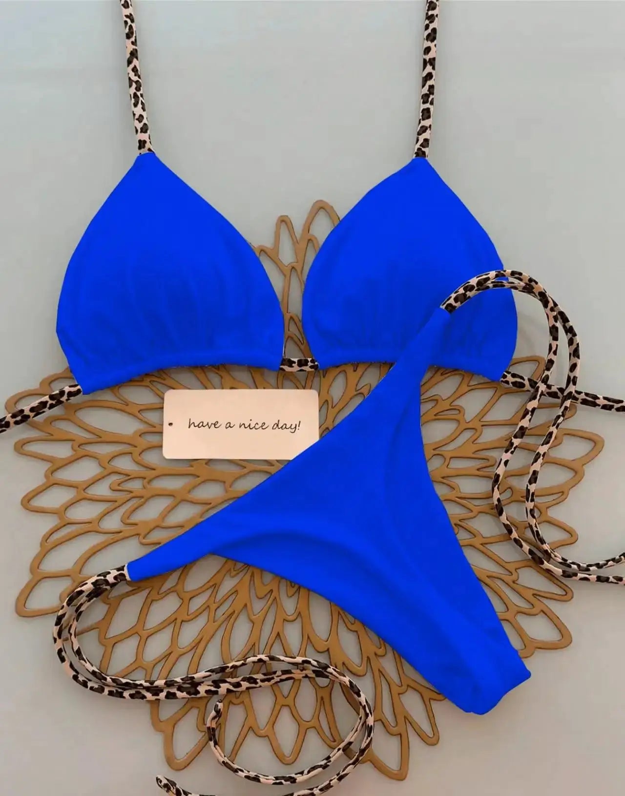 Simples Market blue leopard-strap triangle bikini top and thong bottom