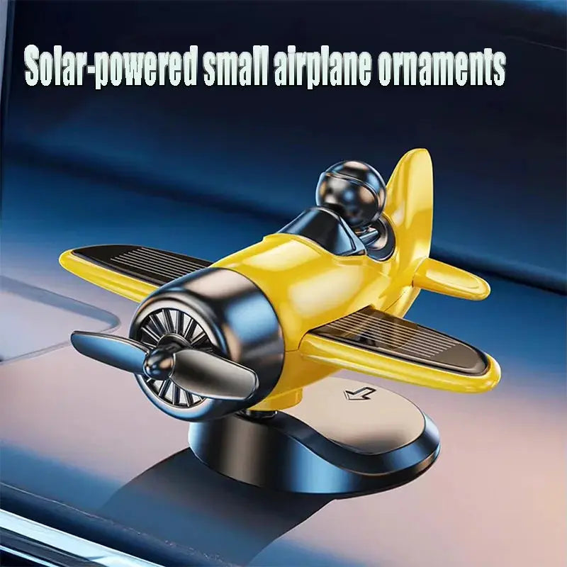 Solar-powered rotating airplane dashboard ornament in yellow for car interior, 360° spin