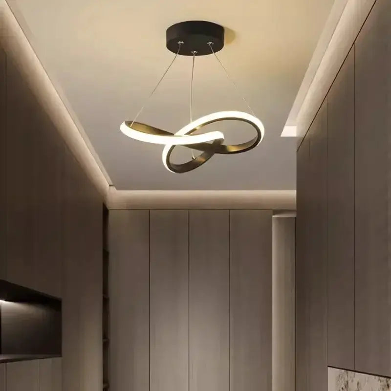 Nordic LED ceiling pendant lamp with intertwined loop rings, warm white illumination, modern decor