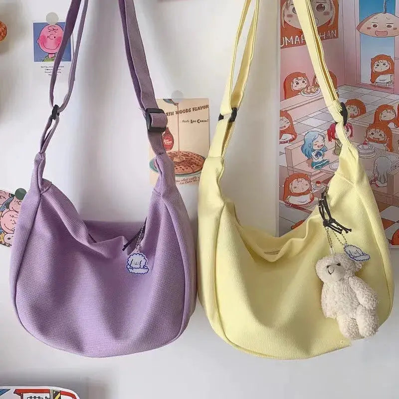 Shoulder bag set of two in purple and pale yellow by Simples Market with adjustable straps.