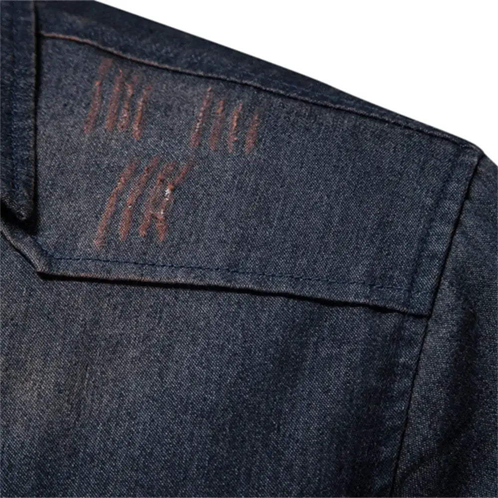 Denim shirt shoulder close-up in dark blue with orange distress marks, long-sleeve casual shirt