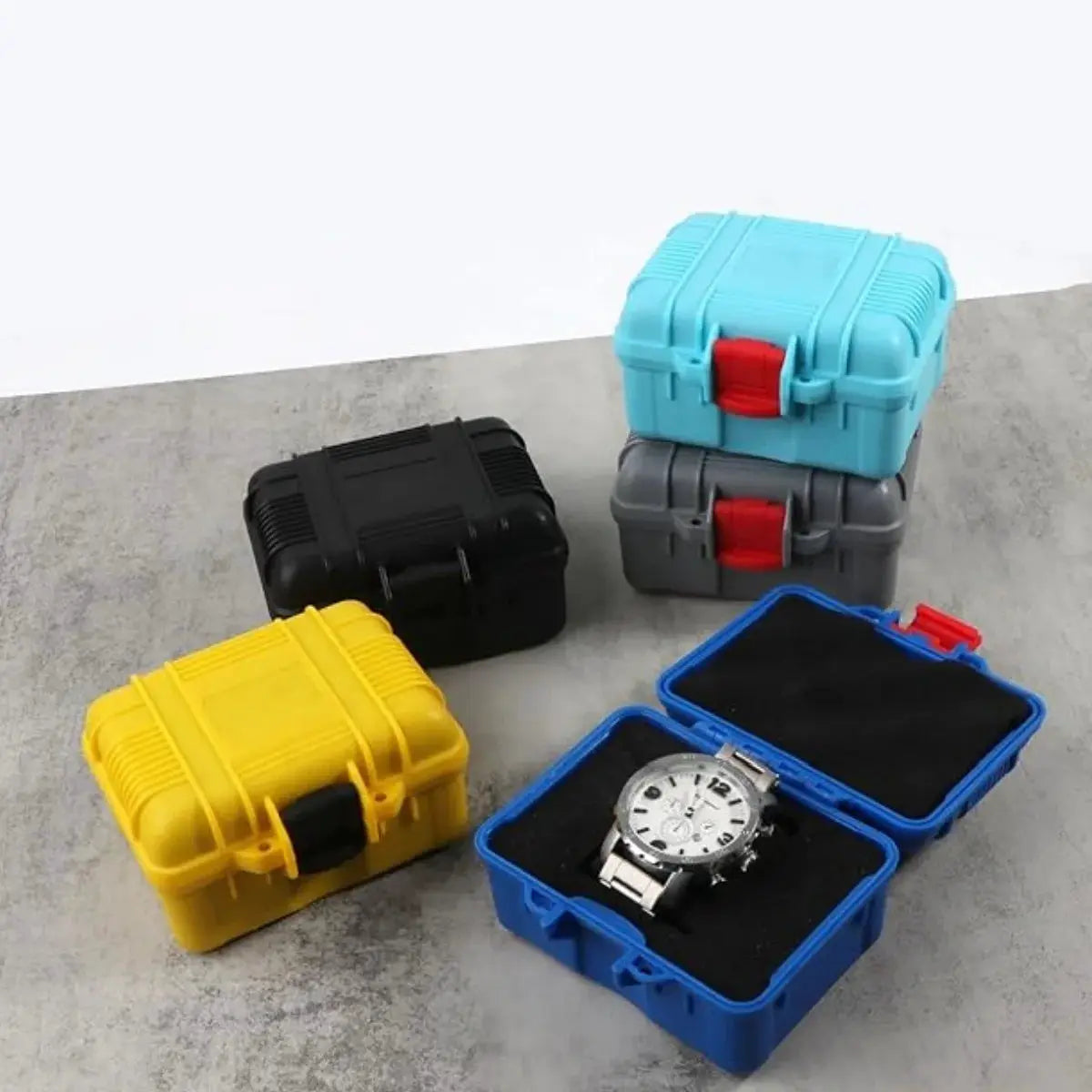 Simples Market PP toolbox storage cases (5) in blue, turquoise, gray, black, yellow; open blue case shows a watch