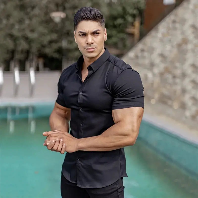 Men's slim-fit black short-sleeve dress shirt by Simples Market on a male model