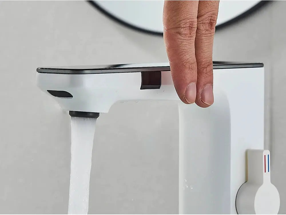 White smart sensor basin faucet with digital display and touchless operation; hot/cold lever visible.