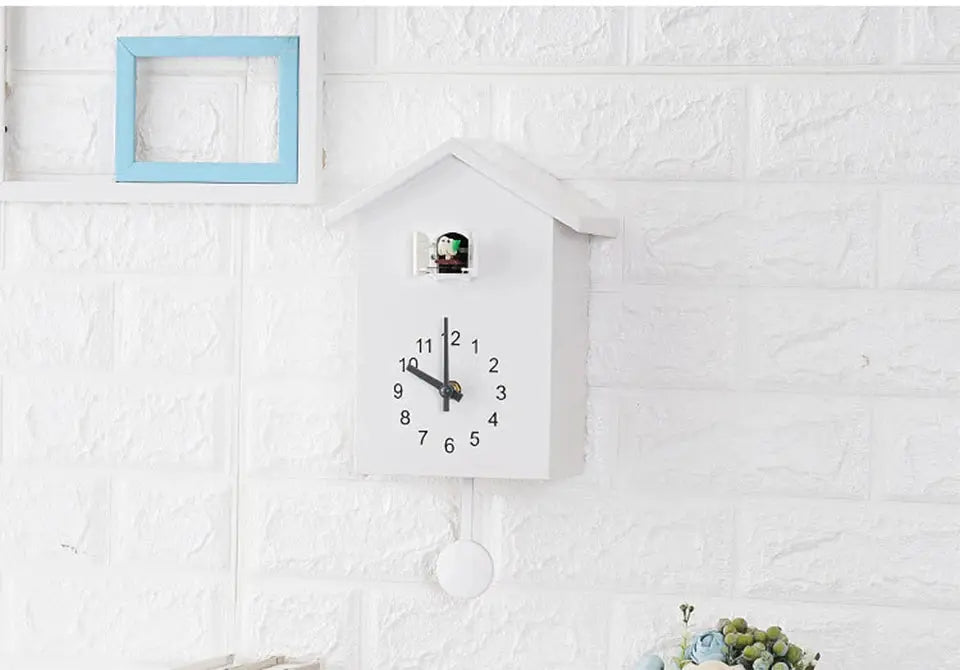 Cuckoo quartz wall clock, white house-shaped design with pendulum, 20x25 cm, Simples Market.