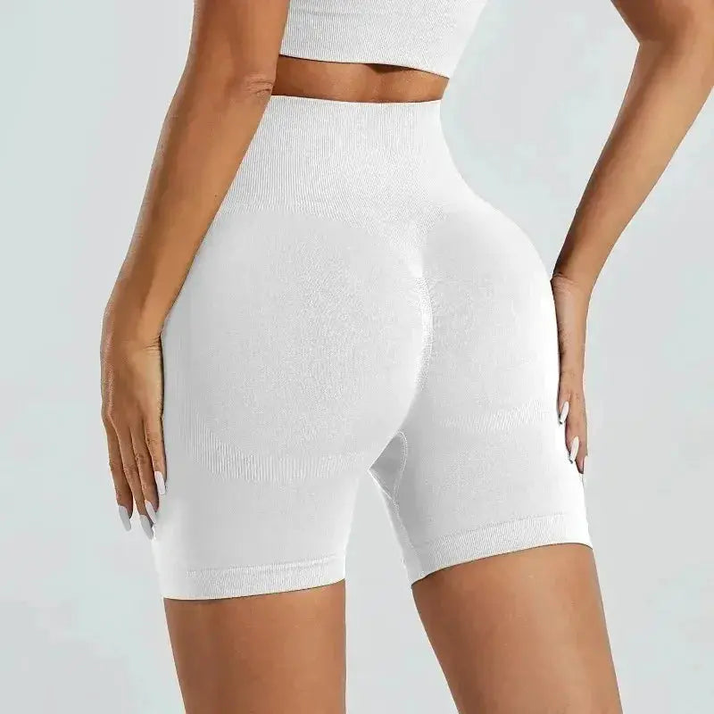 White seamless high-waist women's gym shorts for yoga and training; butt-lifting fit.