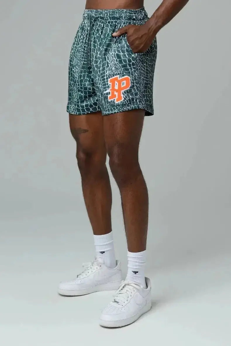 Men's IP Trend casual shorts in teal reptile-print with orange IP logo and quick-dry mesh