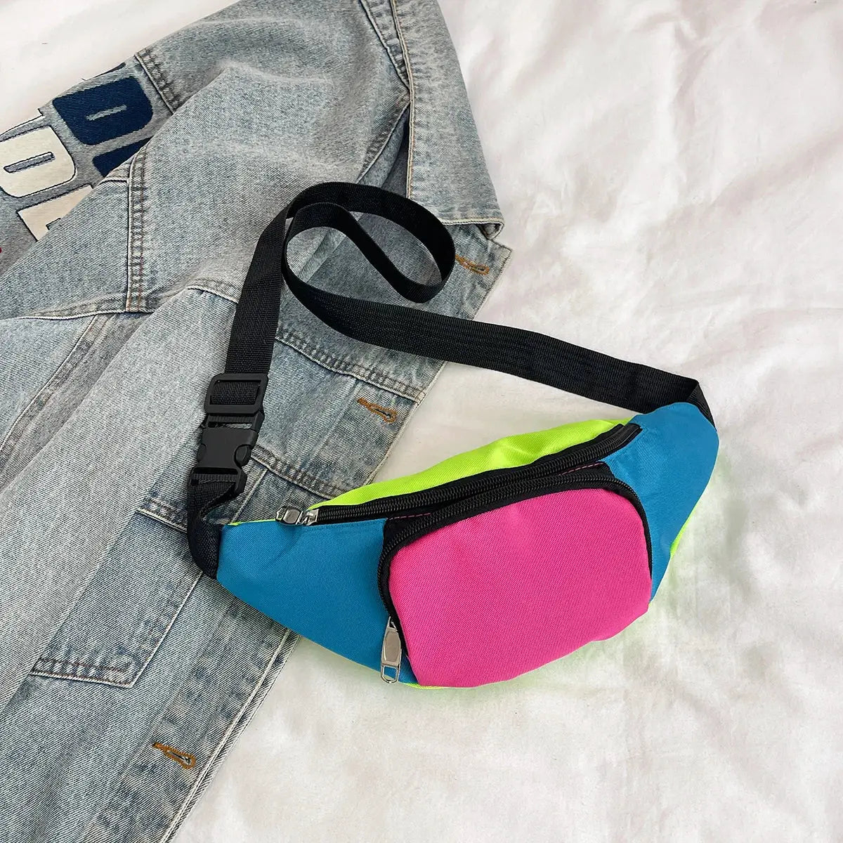 Fanny pack waist bag with neon blue body, lime-green edge and pink front pocket; black adjustable strap
