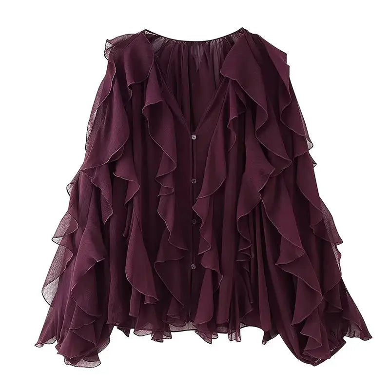 Ruffle blouse for women in burgundy semi-sheer fabric with long sleeves, V-neck and front button placket.
