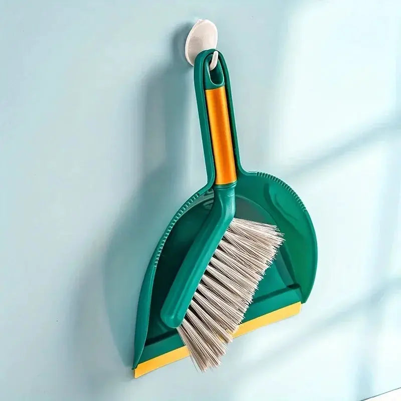 Simples Market desktop broom set; compact green dustpan and brush with yellow accents, wall-mounted