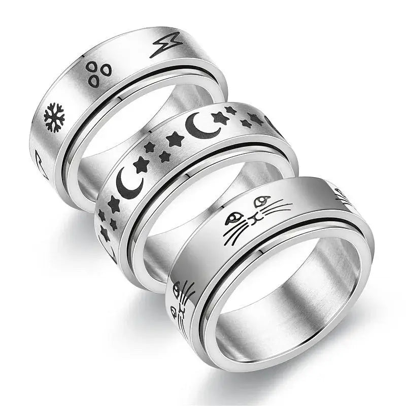 Anti Stress Fidget Spinner Ring Set with 3 stainless steel knuckle rings featuring cat face, moon and stars, and snowflake engravings