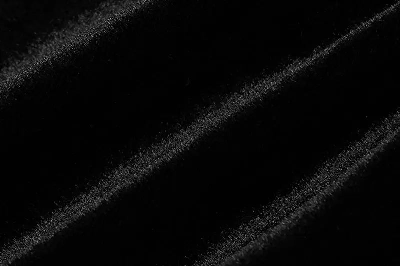 Dulzura black velvet fabric close-up with diagonal nap texture for Simples Market