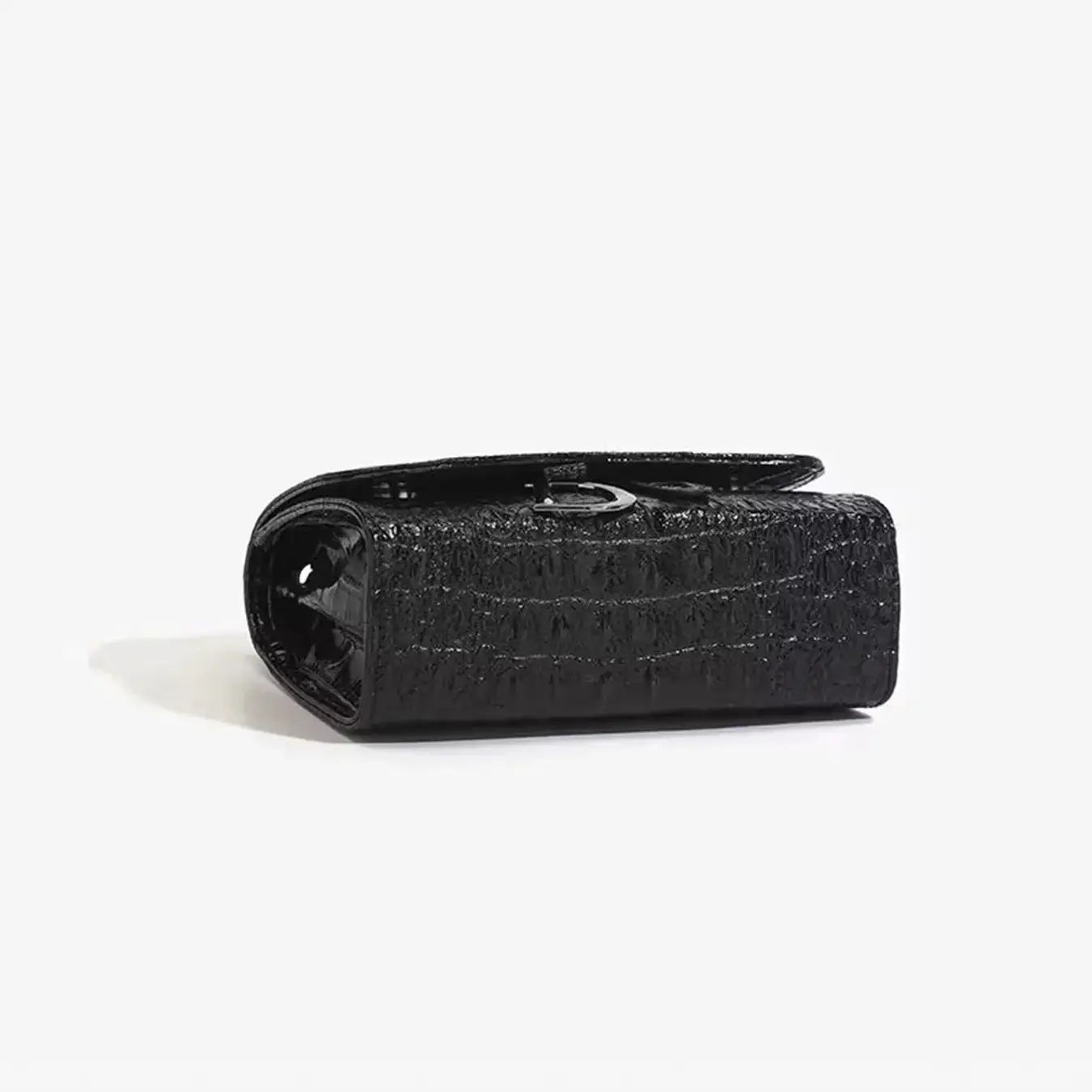 Crossbody handbag, black crocodile-textured with silver chain strap