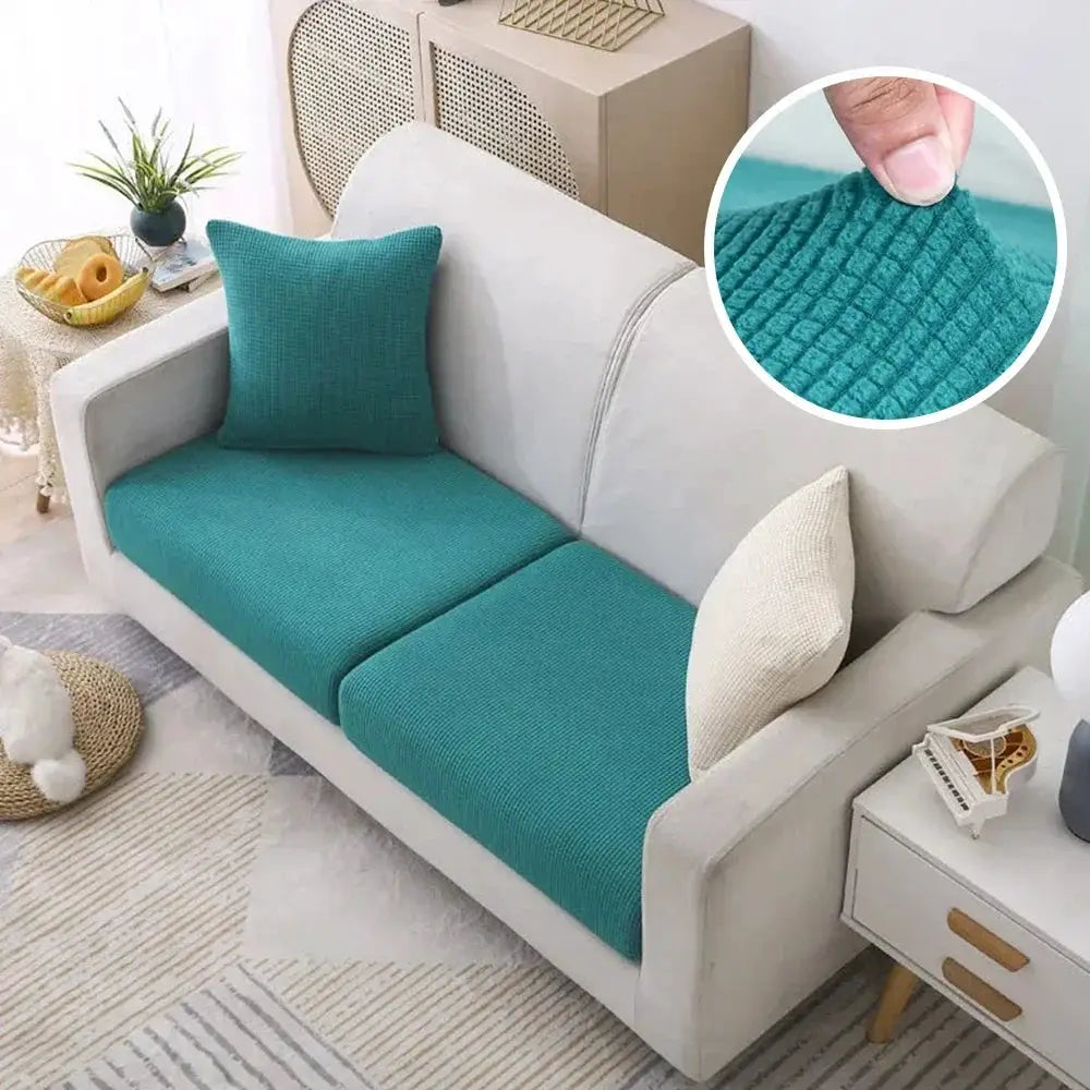 Sofa cover teal polar-fleece stretch on light-gray sofa; removable couch protector