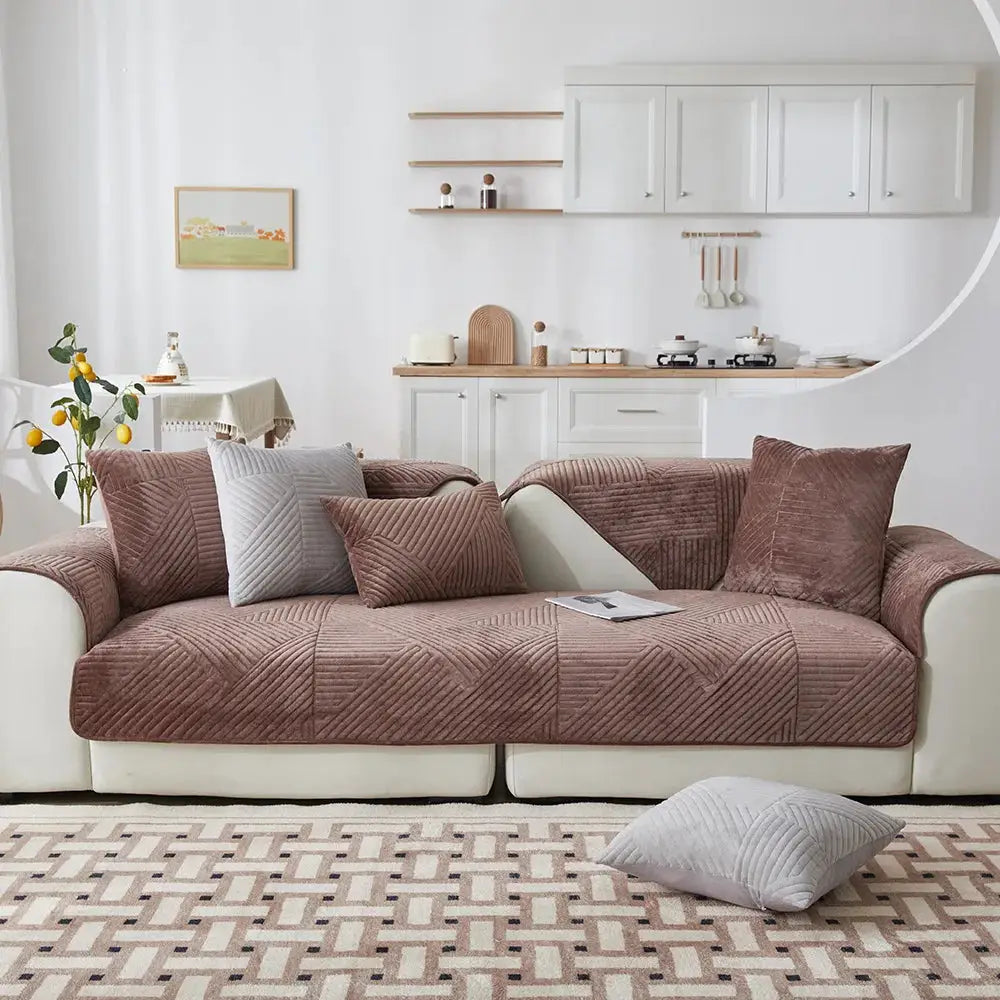 Crystal velvet sofa cover by Simples Market on a brown quilted sofa with cushions