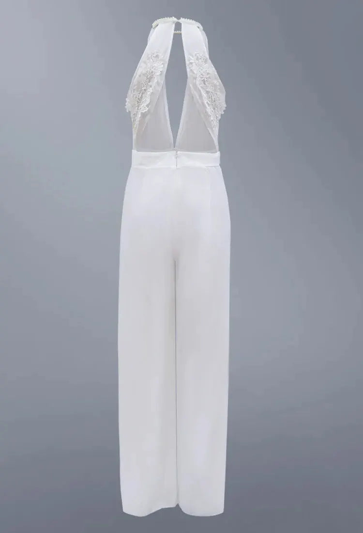 White halter-neck backless lace jumpsuit by Simples Market, wide-leg pants.