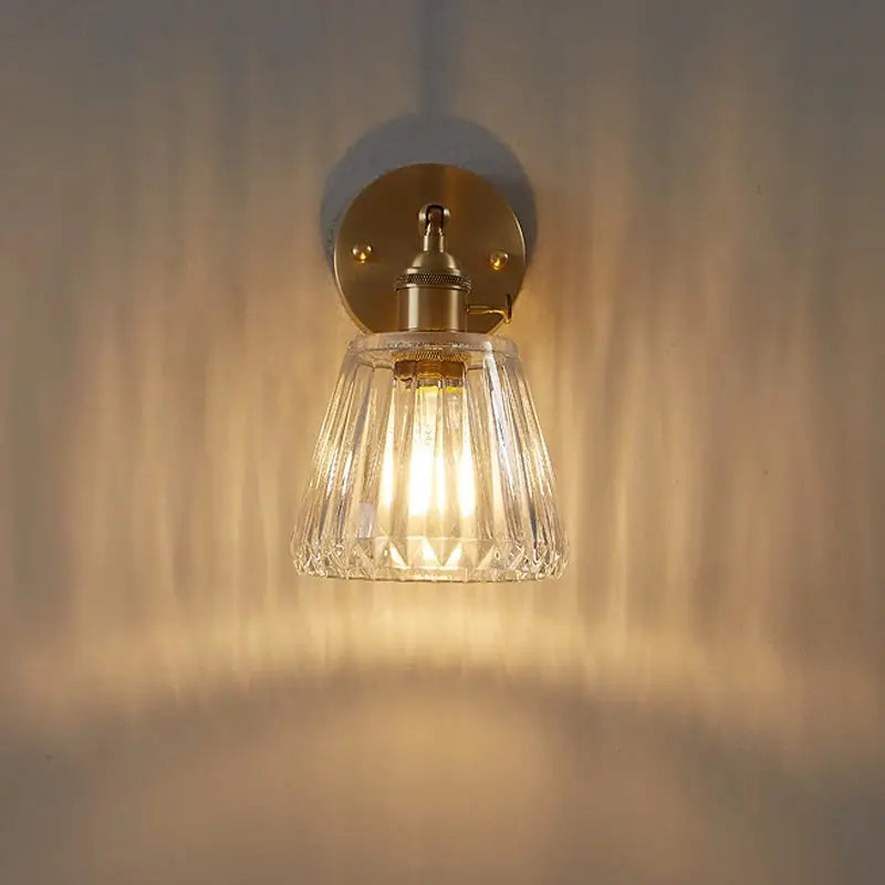 Wall lamp brass glass with faceted crystal shade, warm retro glow