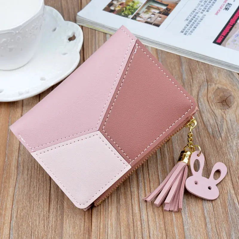 Fashion wallet in pink patchwork PU leather with zipper, tassel and bunny charm