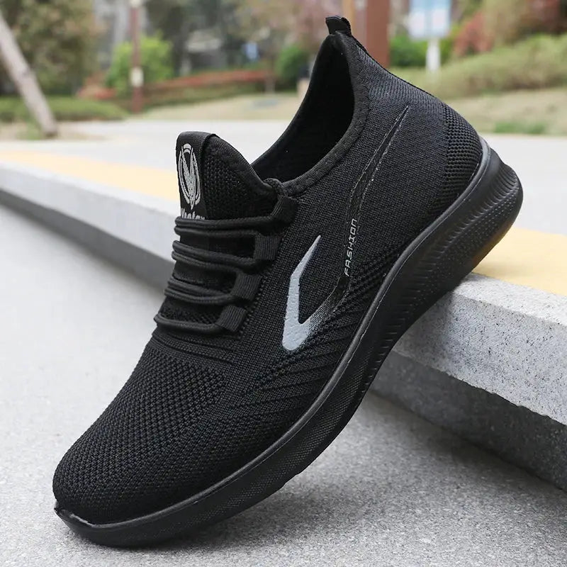 Men's black knitted running shoe with breathable mesh and non-slip sole.