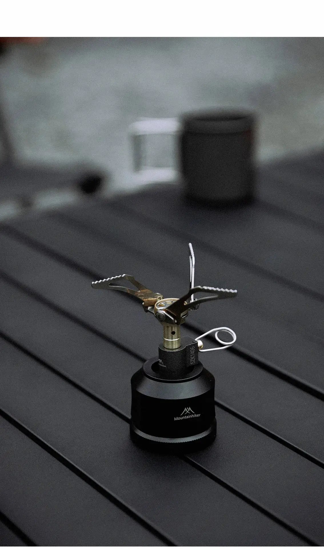 MK-3000W mini camping stove with folding pot supports on a black base; Mountainhiker branding visible.