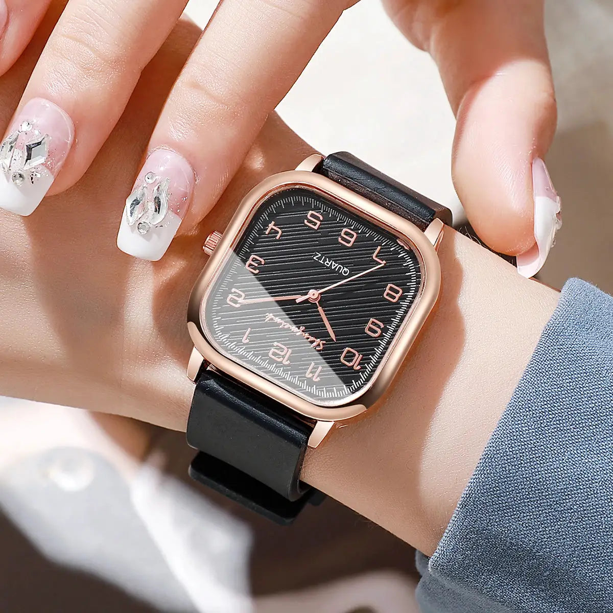 Square women's quartz watch with black dial, rose-gold case and silicone strap