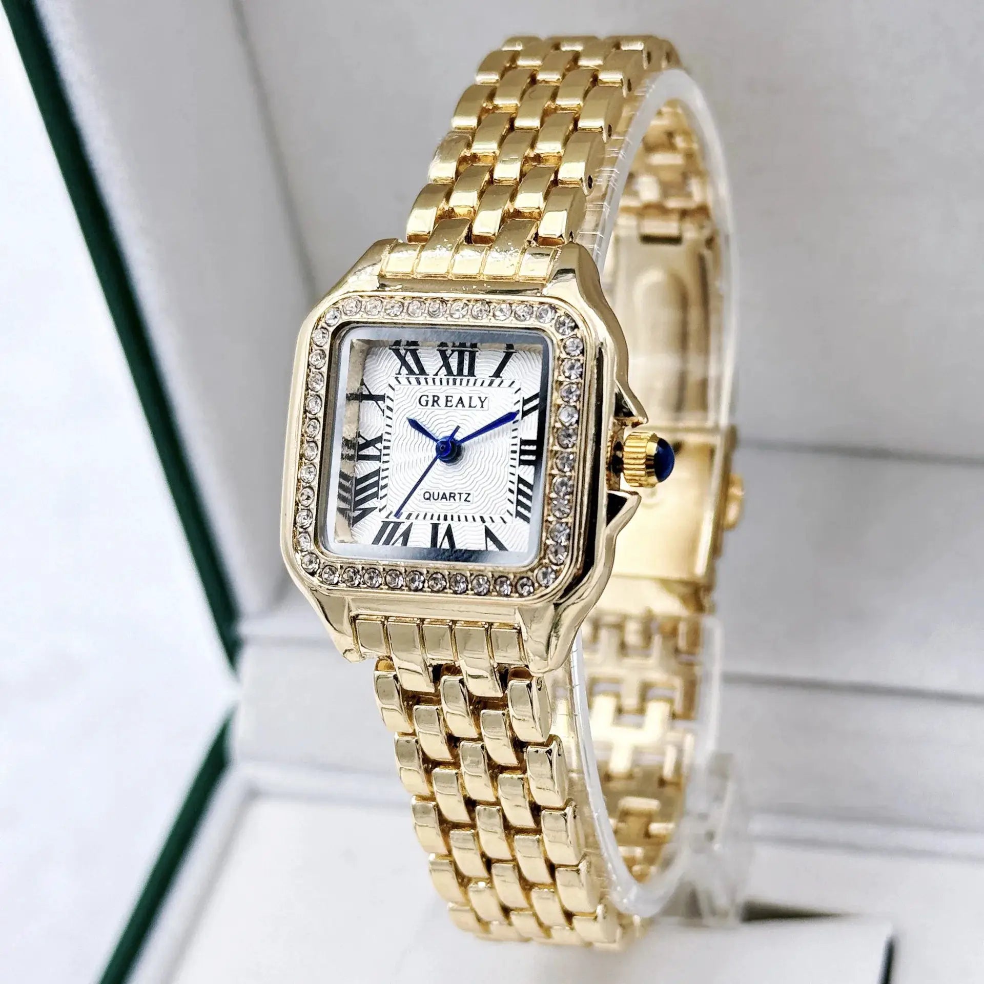 Gold-tone women's quartz wristwatch with crystal-studded rectangular bezel and bracelet