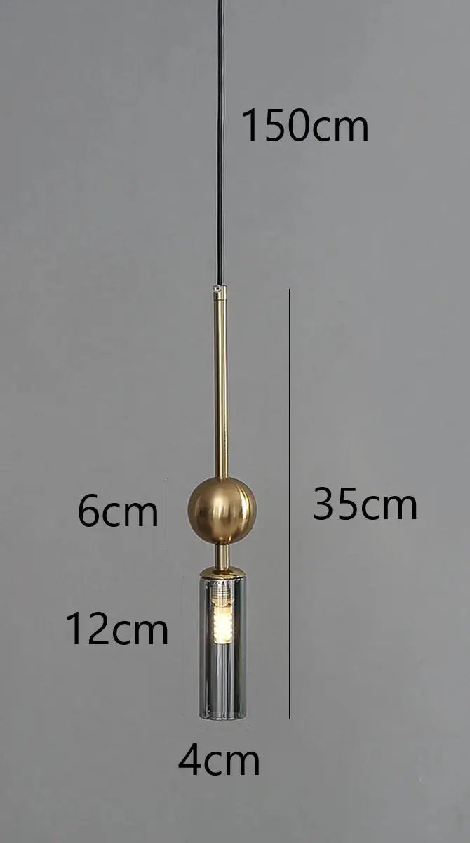 Nordic Light luxury pendant lamp by Simples Market; gold brass sphere with glass cylinder shade on black cord