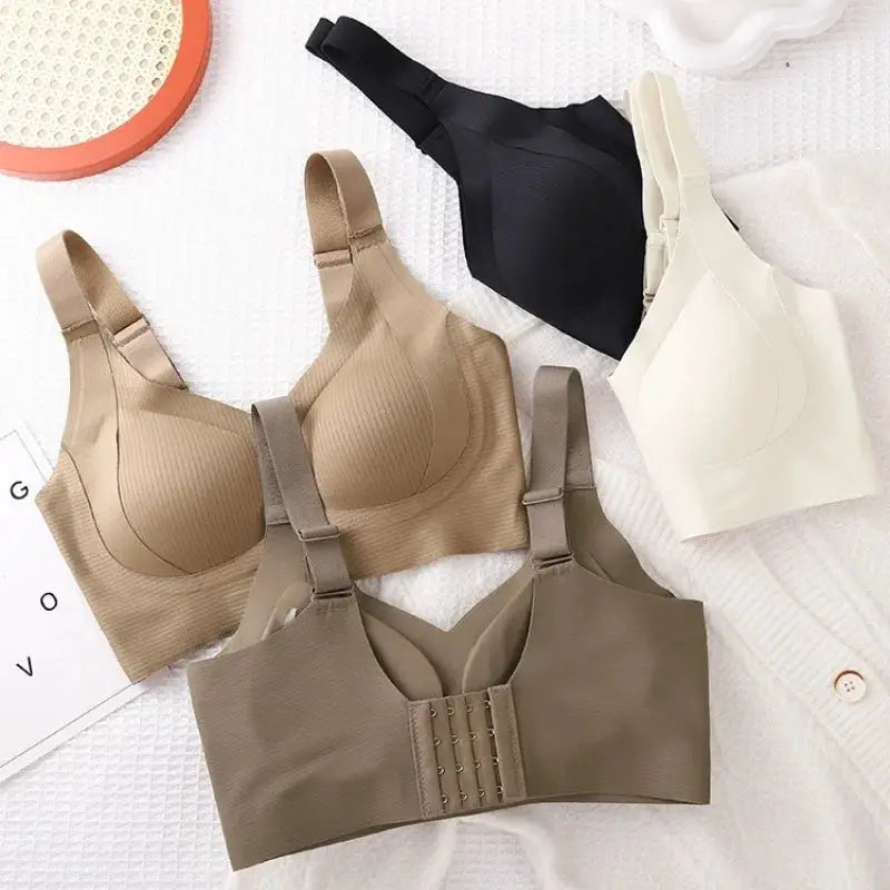 Push-up wireless padded seamless bras set of four in nude, taupe, black, and white with wide straps