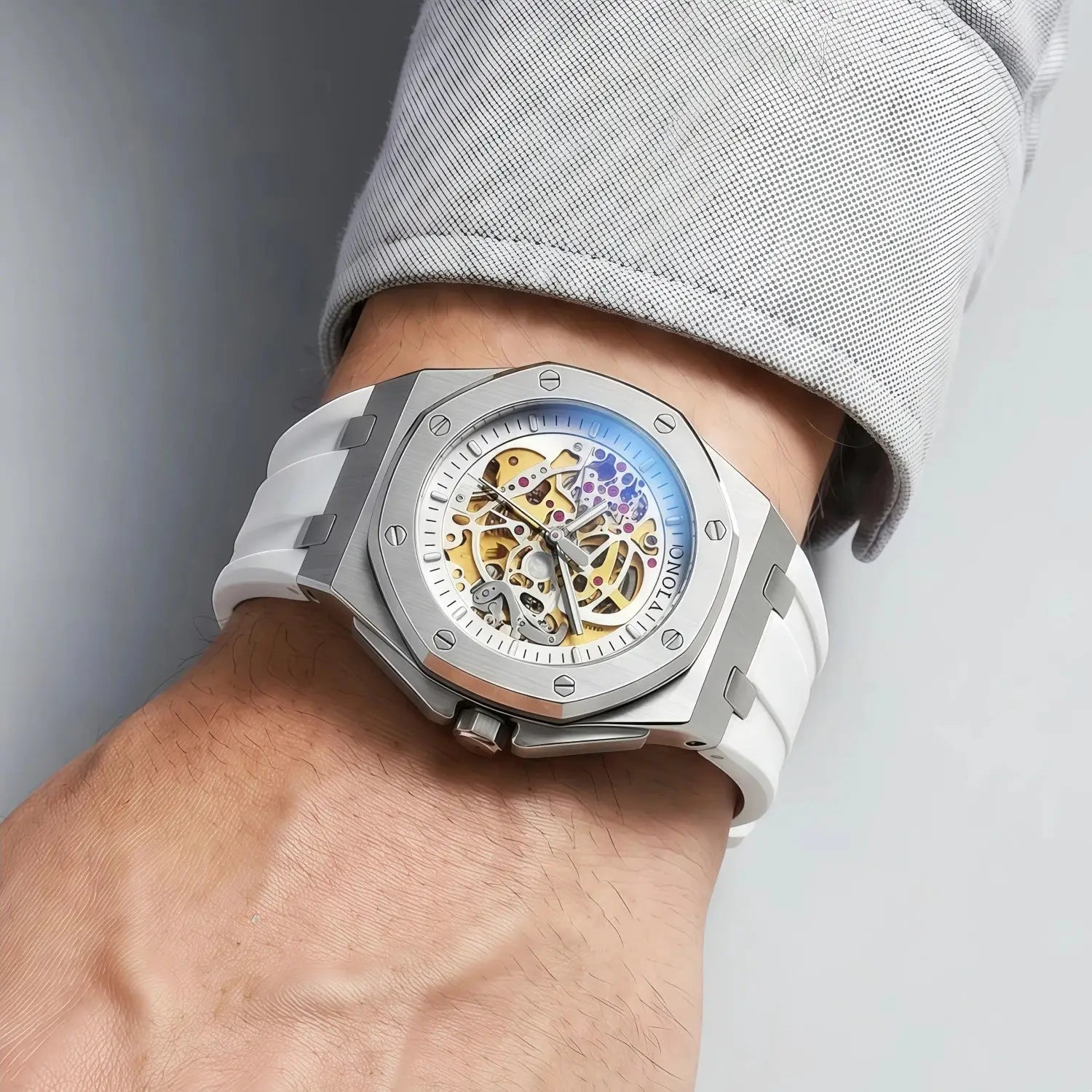 ONOLA skeleton automatic men's wristwatch with stainless steel case, blue inner ring, and white strap