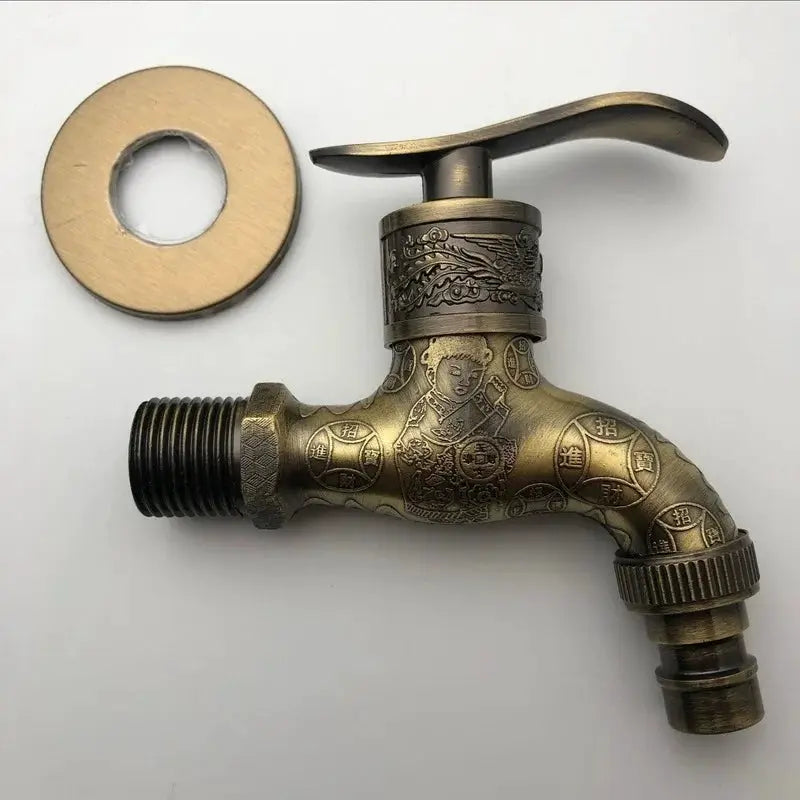Antique wall-mounted outdoor faucet in zinc alloy with ornate carved finish and round escutcheon plate