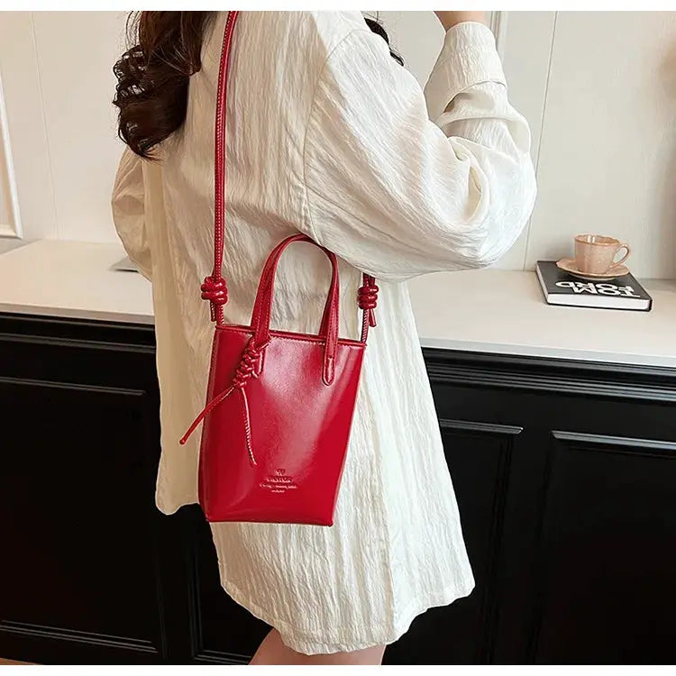 PU leather mini crossbody bag by Simples Market, red with top handles and long adjustable strap