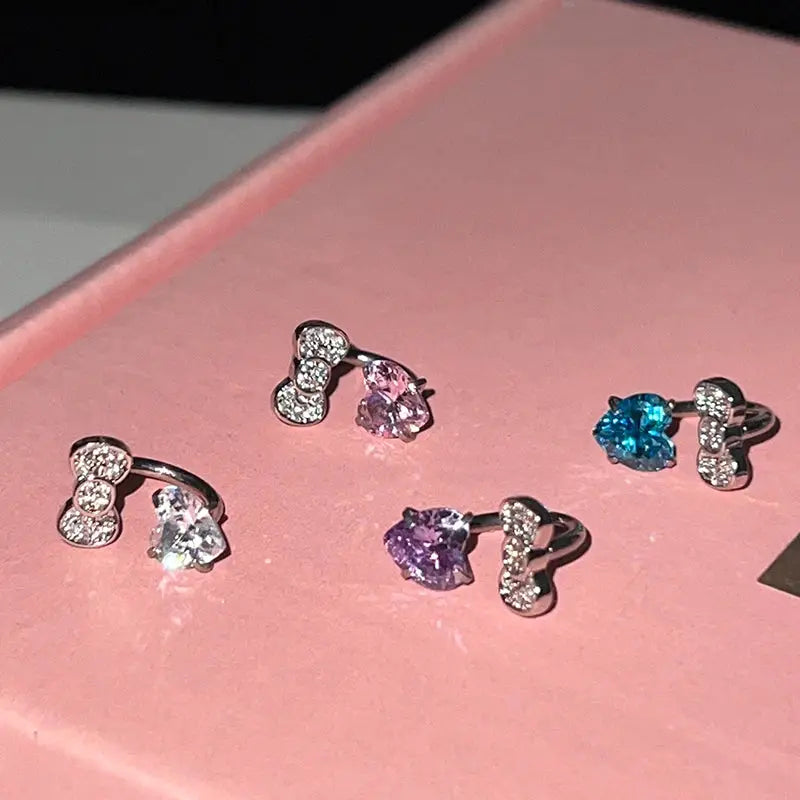 Bowknot love-heart zircon earrings; 316L stainless steel studs with crystals in clear, pink, purple, blue (5 items)