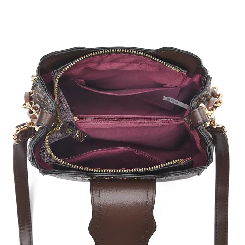 Simples Market women's bucket crossbody handbag with brown leather strap and burgundy lining.
