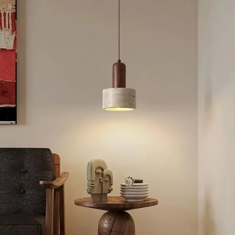 Droplight pendant lamp by Simples Market, travertine with wooden top and yellow-lit interior.