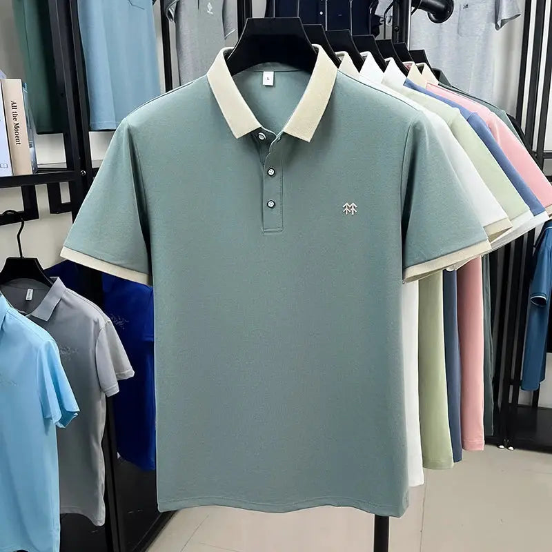 Simples Market silk-cotton polo shirt in teal with cream collar, embroidered chest logo; several color options on rack