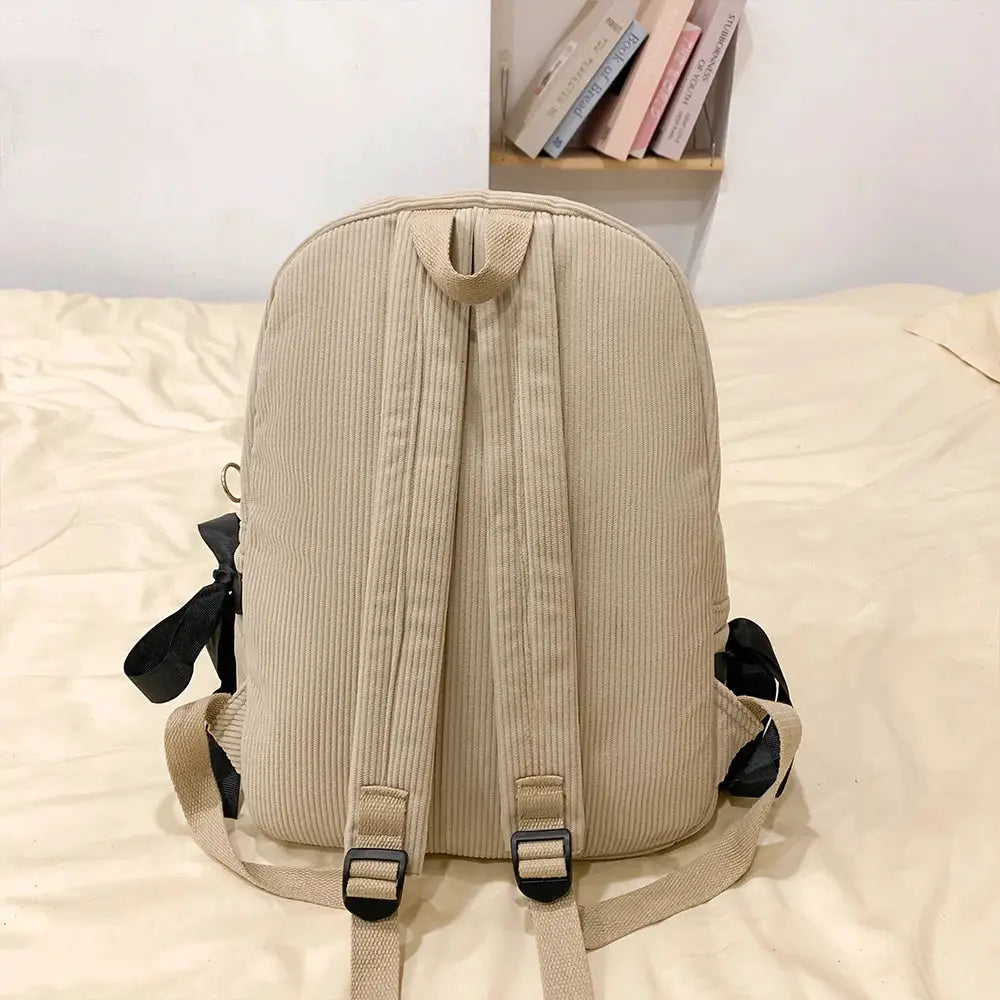 Beige corduroy backpack with adjustable straps for commuting and college use
