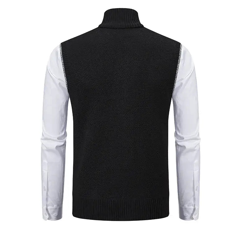 Men's knitted sleeveless sweater vest in black worn over a white shirt with a stand collar