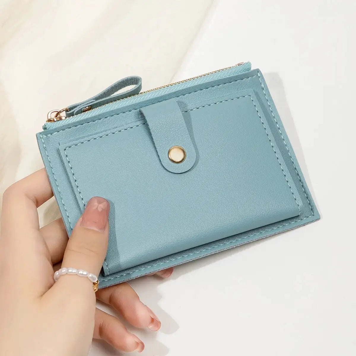 Simples Market women's slim mini PU leather card wallet in light blue with zip top and front snap strap