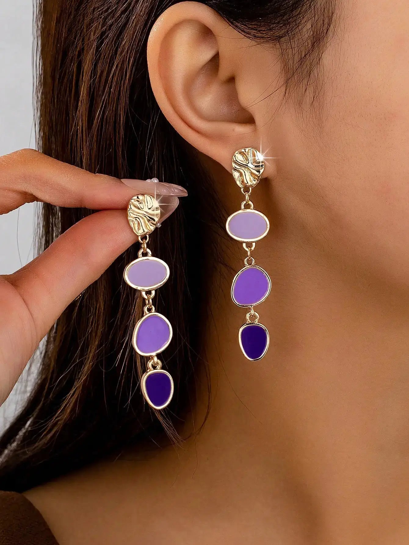 Pair of gold-tone oil-drip textured drop earrings with lavender oval beads