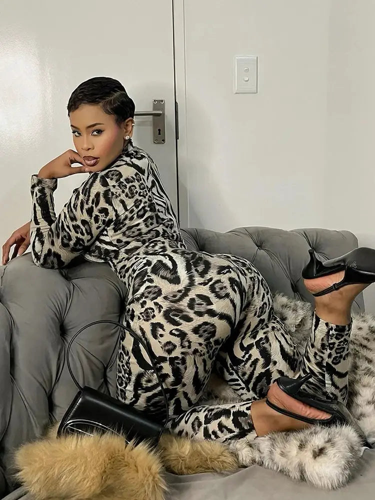 Kliou leopard print jumpsuit for women, beige-peach fabric, full-sleeve turtleneck, skinny fit.