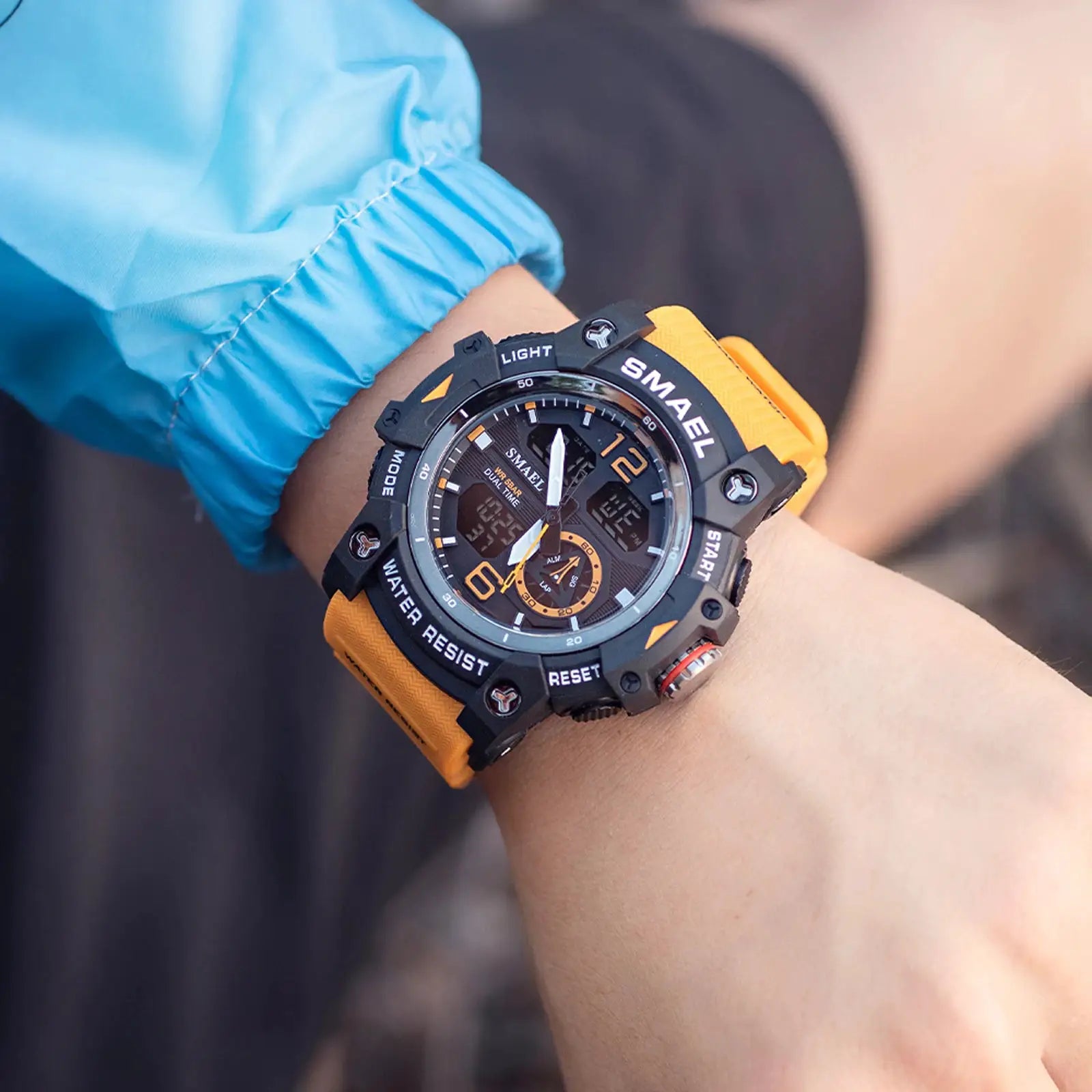 SMAEL sport watch for men with black rugged case and orange strap, military style, dual time display, LED backlight