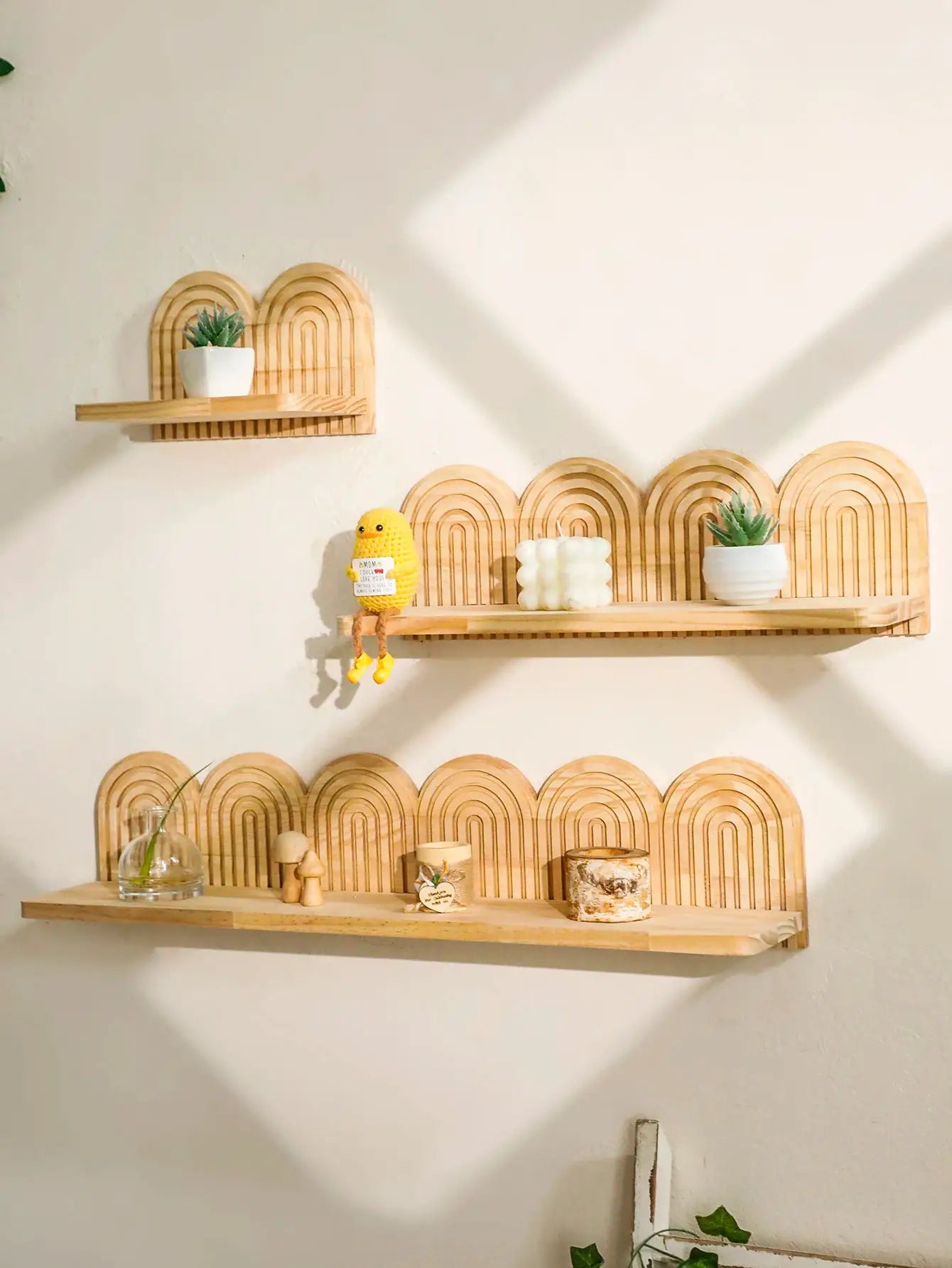 Three-tier boho wooden wall-mounted shelves with geometric arch backs in natural wood finish