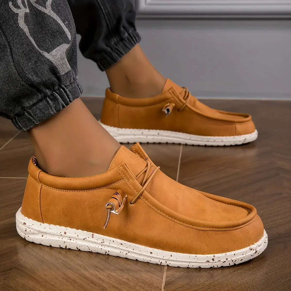 Men's tan loafers with white speckled sole; casual slip-on leather walking shoes (two shown)