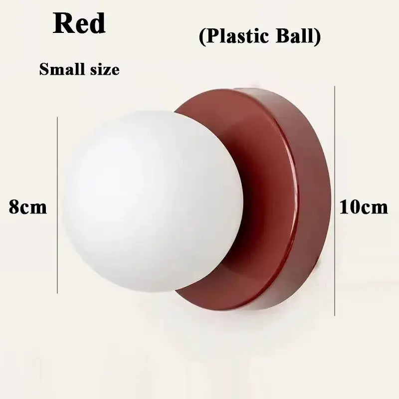 Simples Market Macaron soft-style small wall lamp with red iron base and plastic ball shade